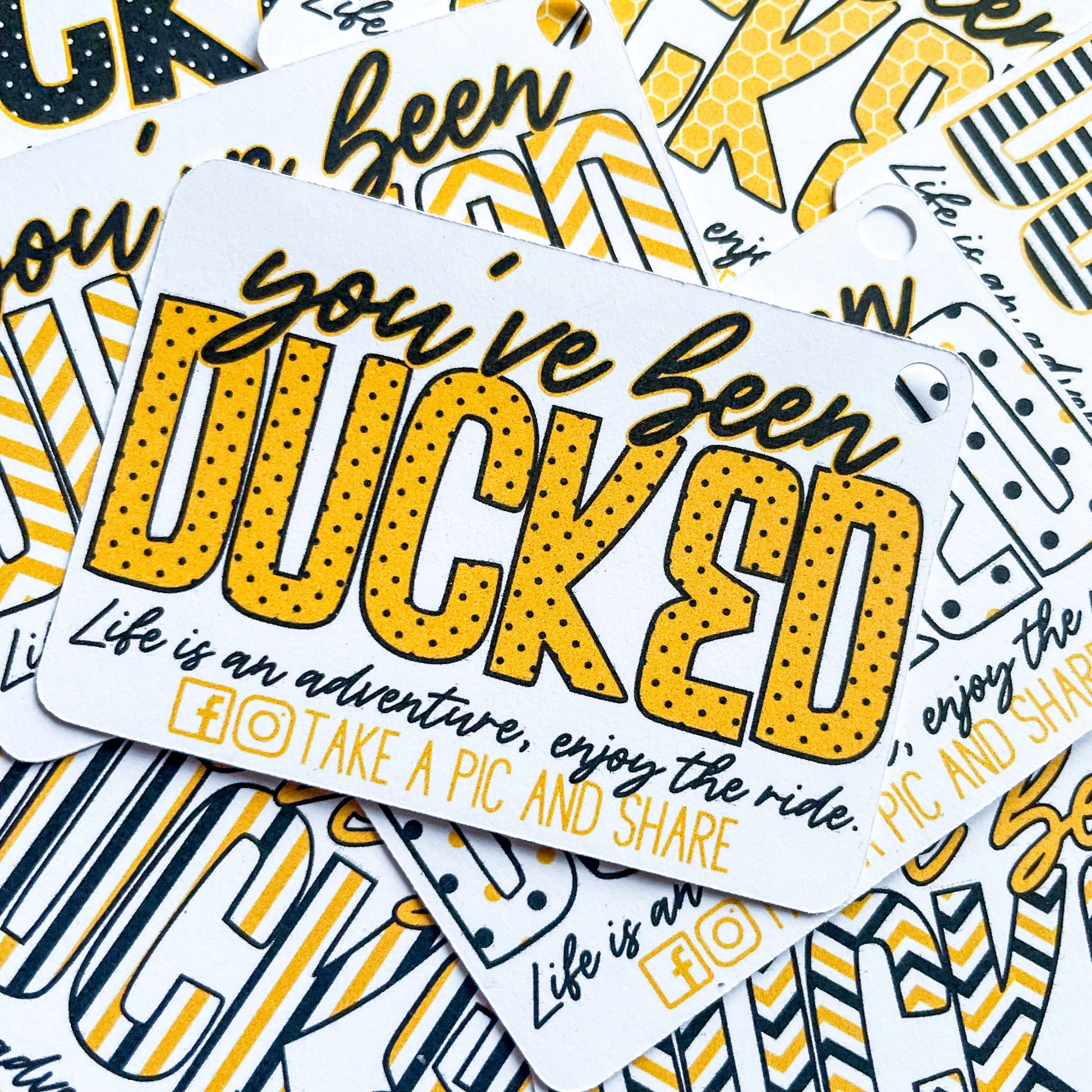 A bunch of Bumblebee Duck Tags that say you're beed ducked.
